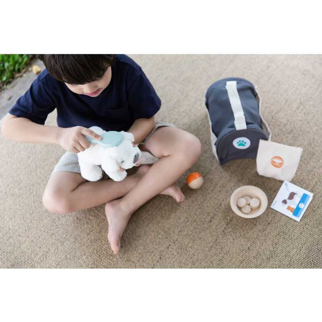 Kid playing PlanToys Pet Care Set