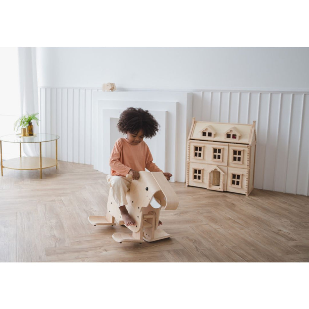 Kid playing PlanToys Walking Elephant