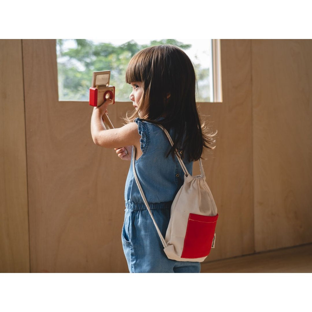 Kid playing PlanToys Vlogger Kit