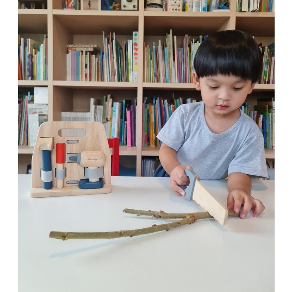 Kid playing PlanToys Handy Carpenter Set