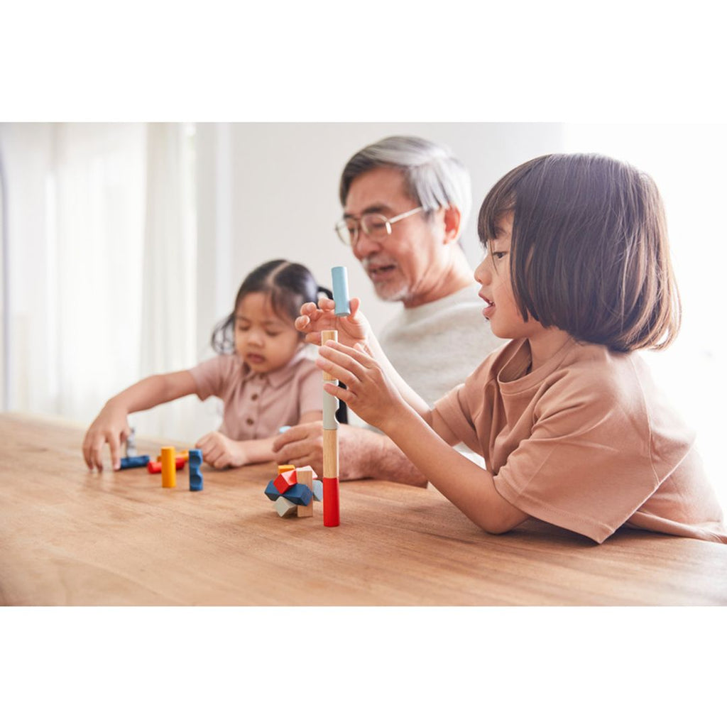 Kid playing PlanToys Rectangular Puzzle