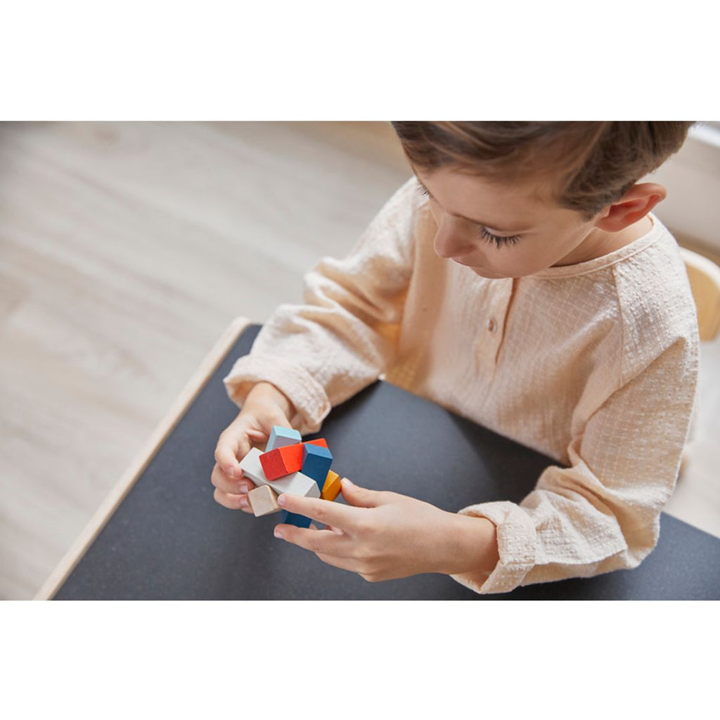 Kid playing PlanToys Rectangular Puzzle