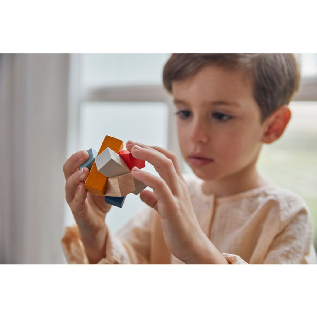 Kid playing PlanToys Rectangular Puzzle