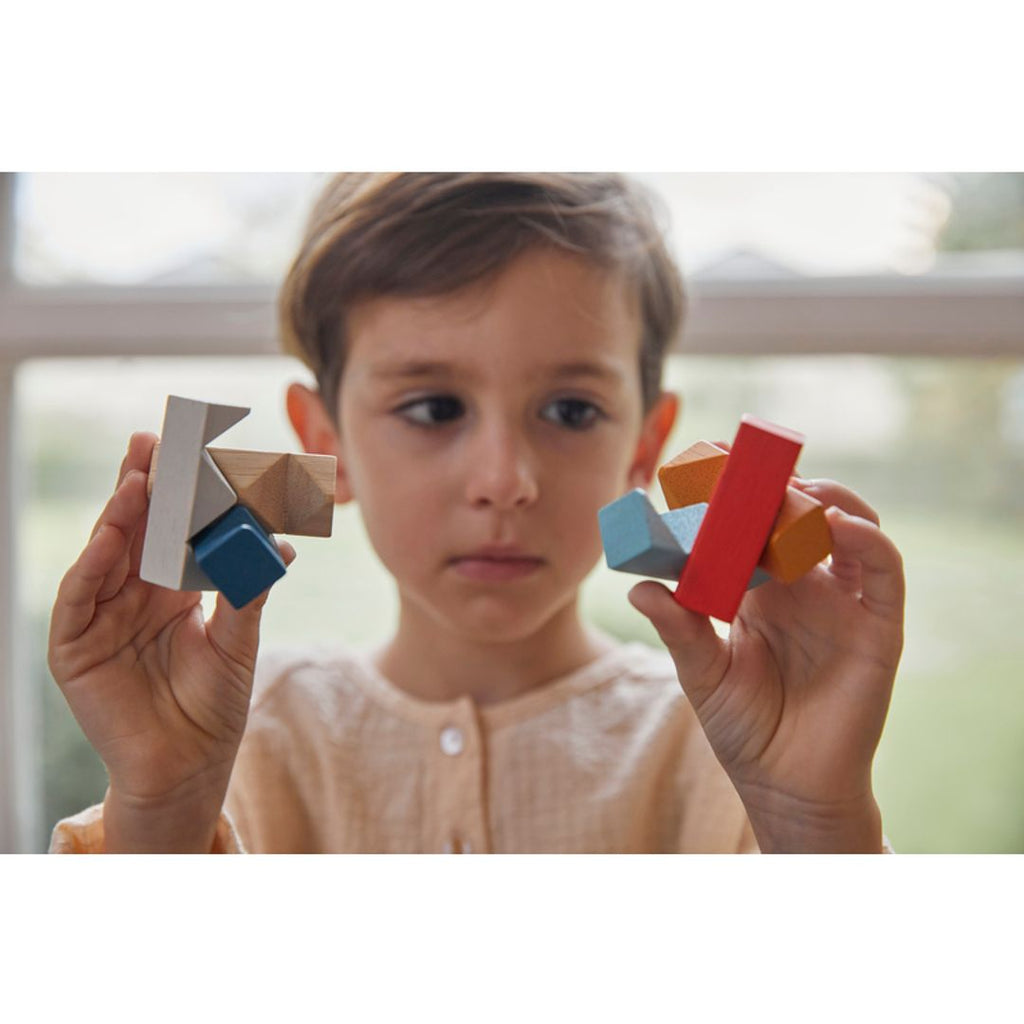 Kid playing PlanToys Rectangular Puzzle