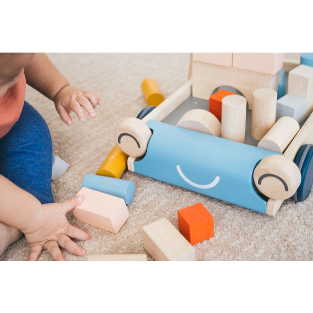 Kid playing PlanToys Baby Walker - Orchard