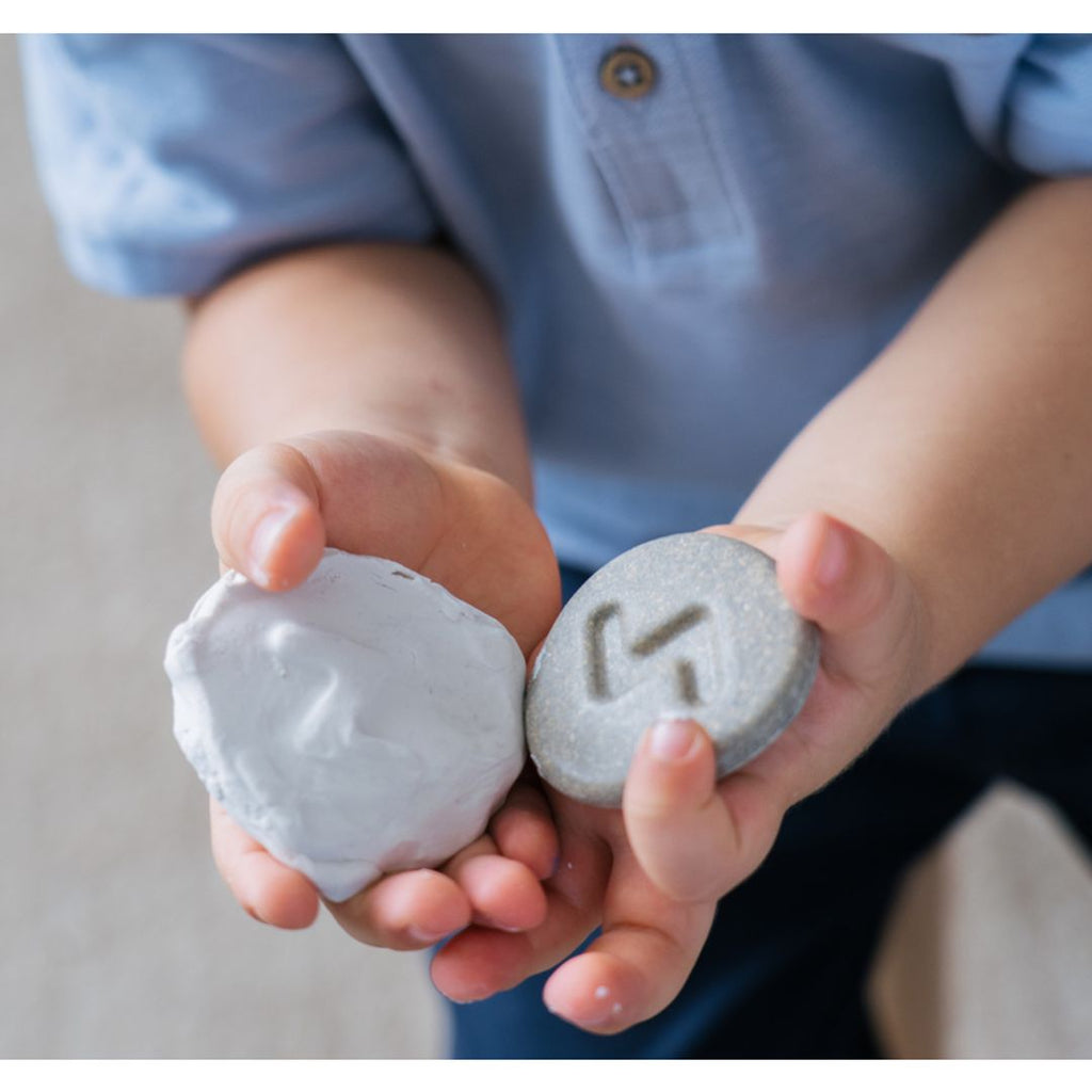 Kid playing PlanToys Tactile Stone