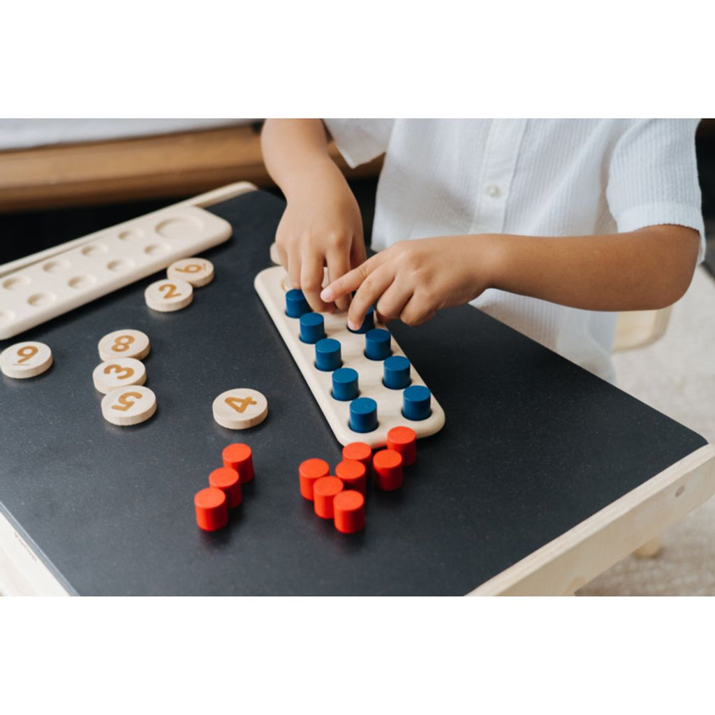 Kid playing PlanToys Ten Frame - Unit Plus