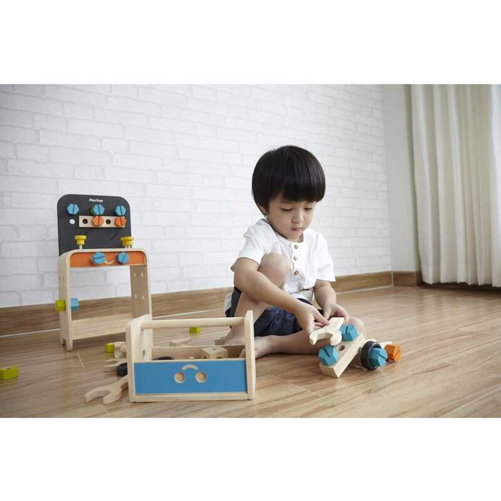 Kid playing PlanToys Construction Set