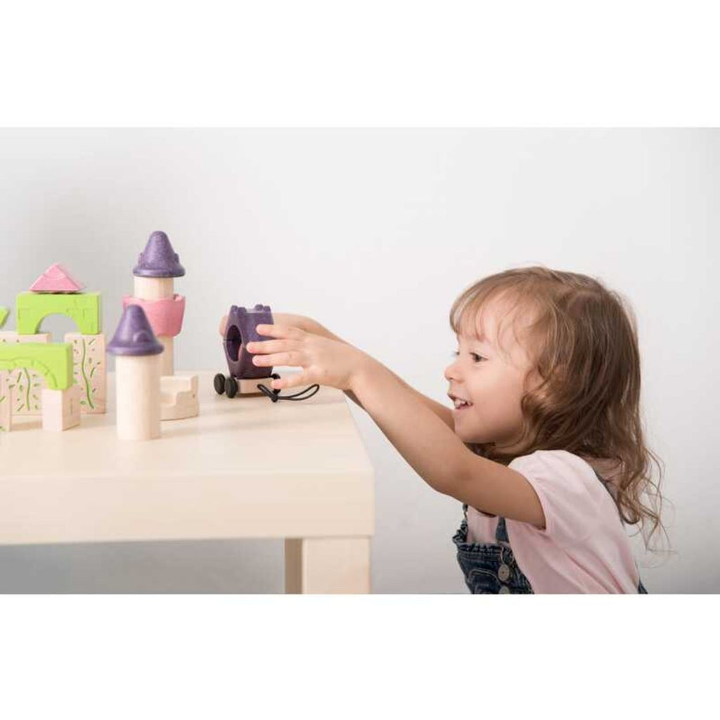 Kid playing PlanToys Fairy Tale Blocks