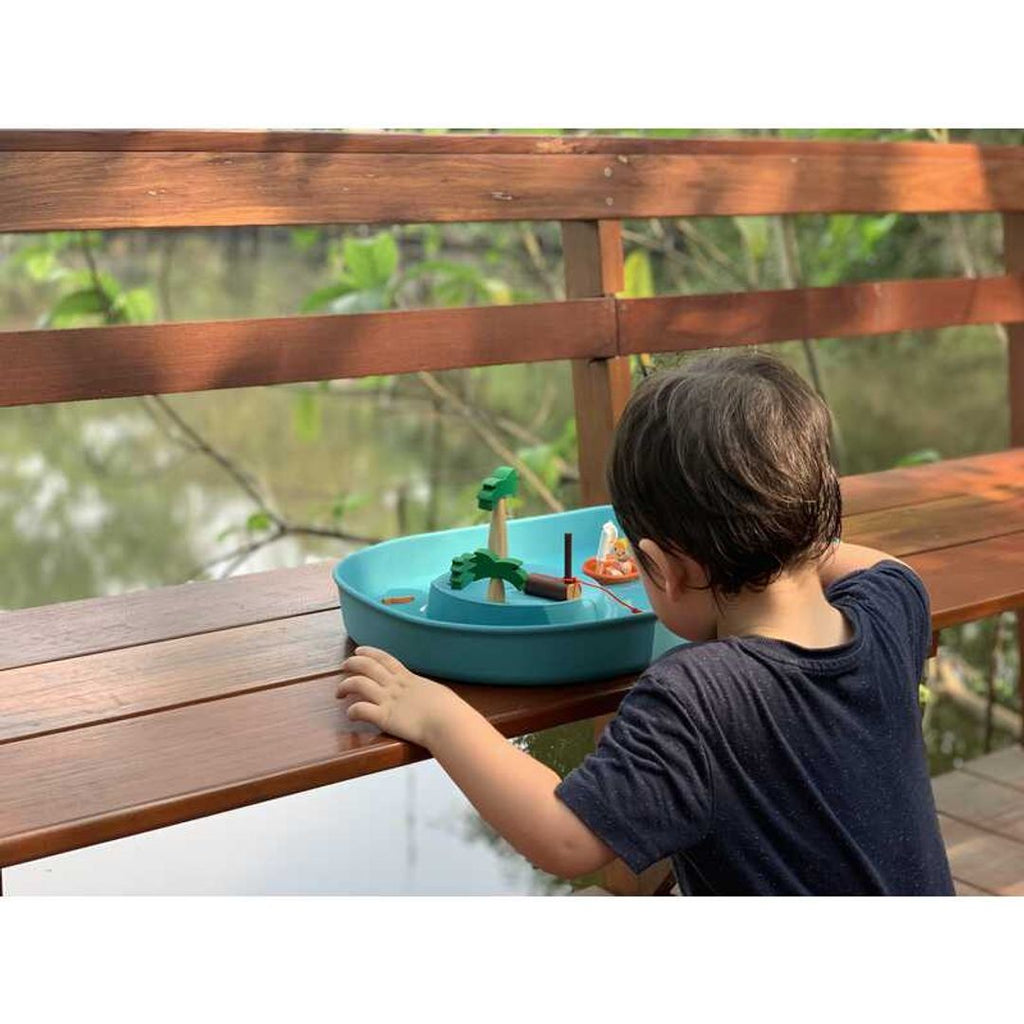 Kid playing PlanToys Water Play Set