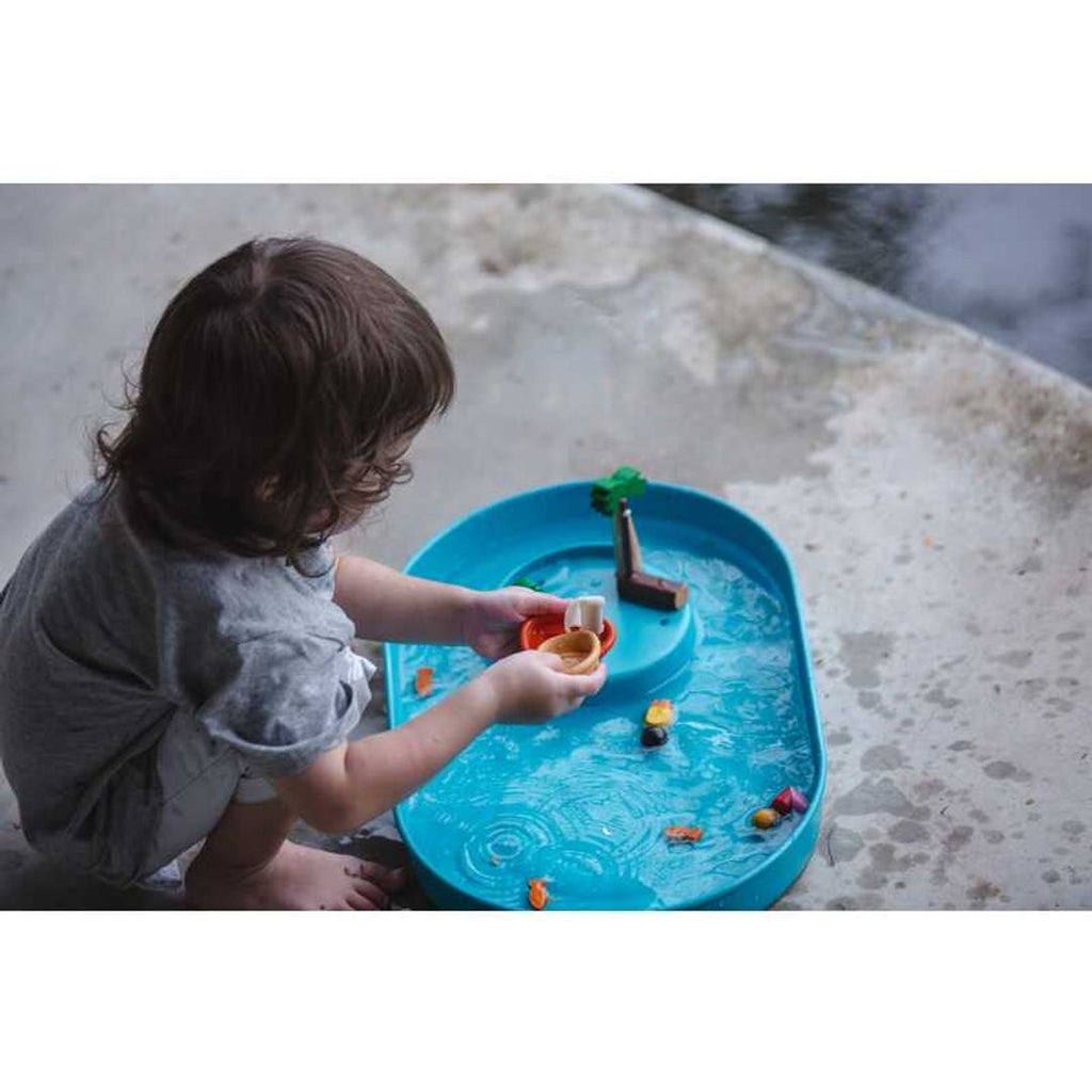 Kid playing PlanToys Water Play Set