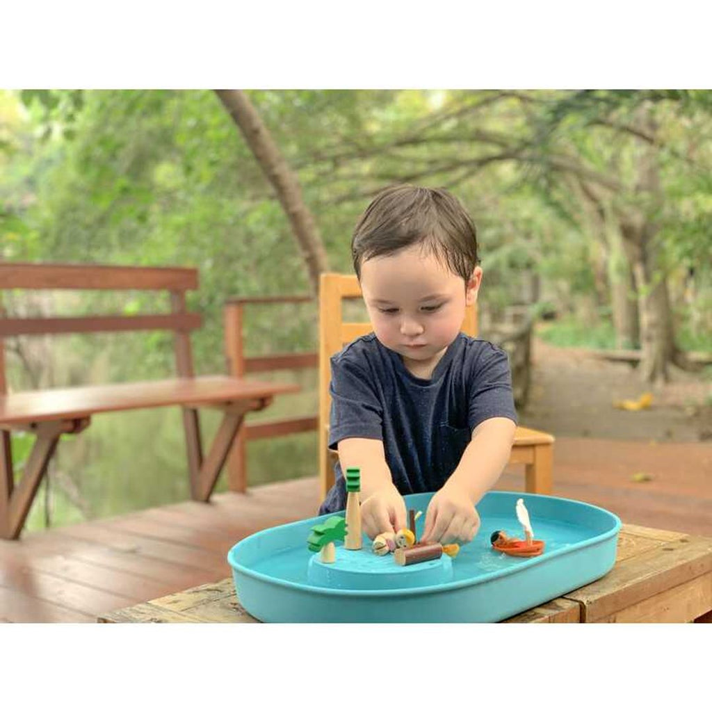 Kid playing PlanToys Water Play Set