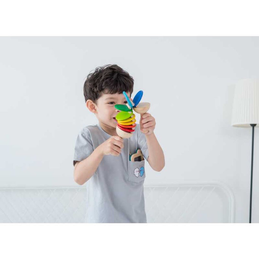 Kid playing PlanToys Clatter