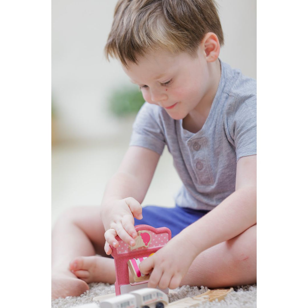 Kid playing PlanToys Ice Cream Shop