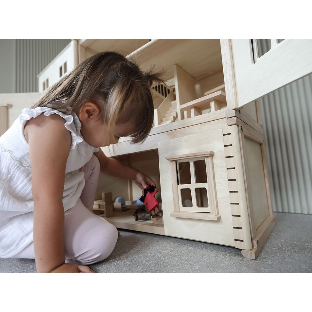 Kid playing PlanToys Victorian Dollhouse Basement Floor