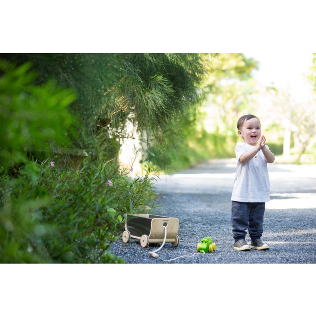 Kid using PlanToys Wagon - Black